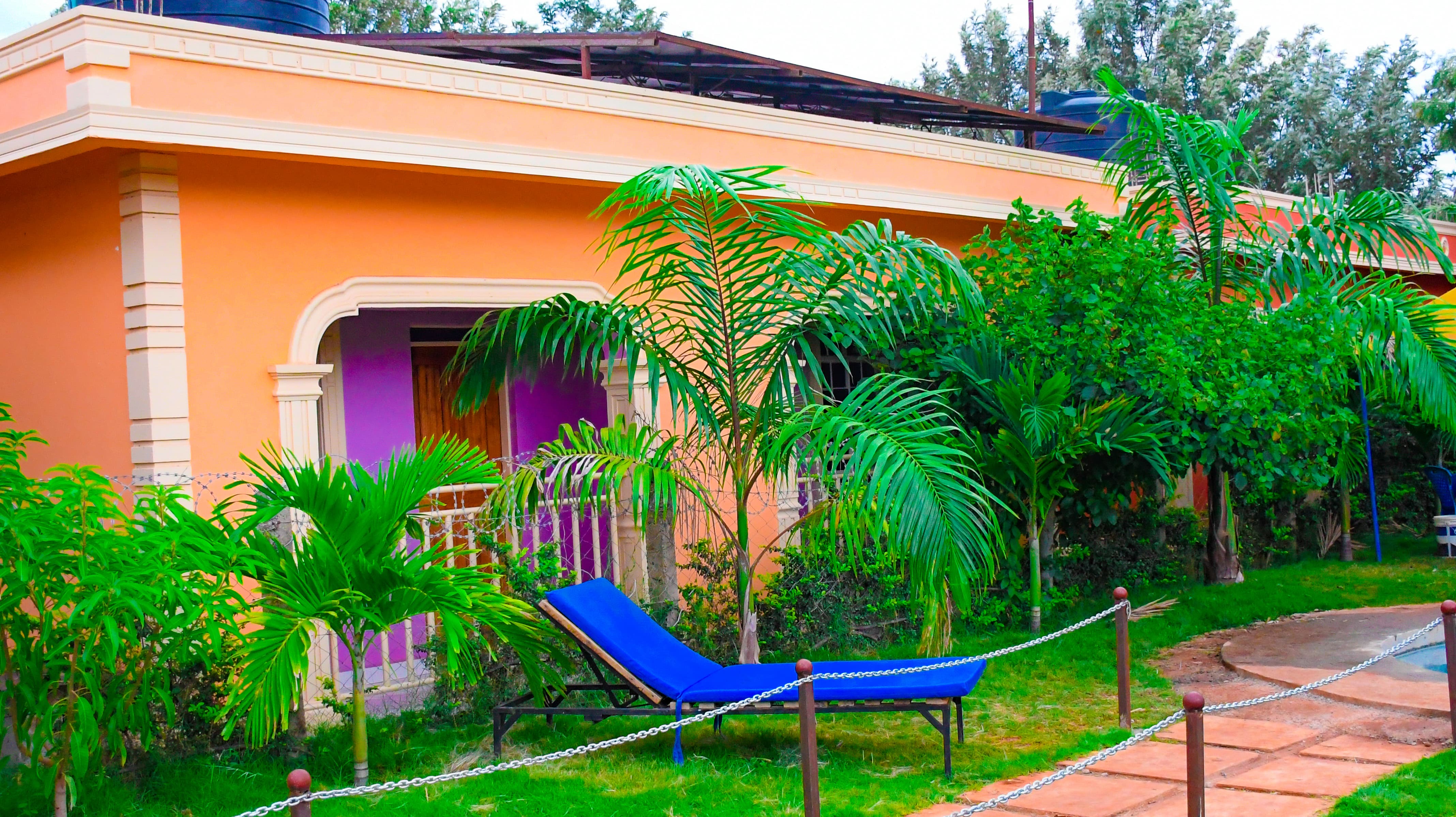 Relax Eden Gardens swimming pool surrounded by garden greenery